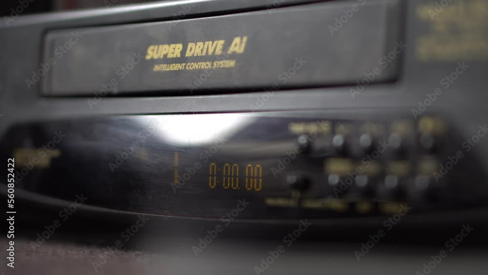Vhs Tape Being Placed Into Dusty Tape Deck and press to play Vhs Tape Being Placed Into Dusty Tape Deck and press to play