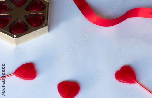 valentines day background with gifts, hearts and red ribbons decorating
white background with place for text design