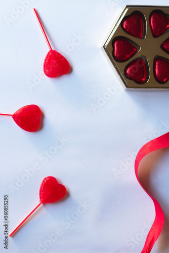 valentines day background with gifts, hearts and red ribbons decorating
white background with place for text design