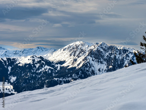 Swiss Alps winter landscape with snow and sun, mountains in Europe