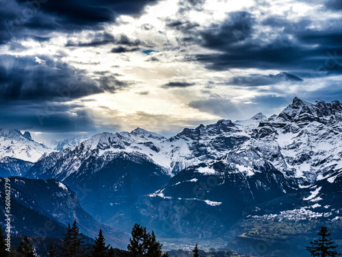 Swiss Alps winter landscape with snow and sun, mountains in Europe © 31etc