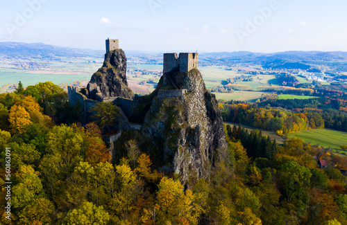 Impressive autumn landscape of Bohemian Paradise overlooking ruins of medieval Trosky Castle on tops of two stone crags  Czech Republic..