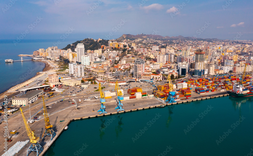 Aerial view of large seaport in Albanian city of Durres on coast of Adriatic Sea overlooking shipyard 