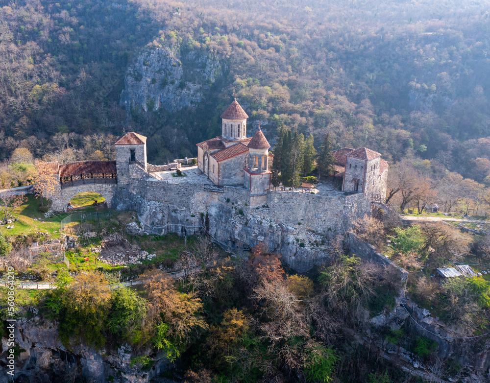 Scenic view from drone of architectural complex of Motsameta Monastery on rock in mountainous region of Imereti in Georgia in springtime.