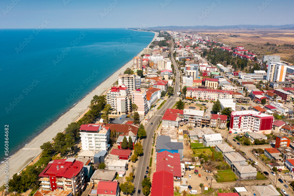 Aerial view of buildings and sunny empty beaches of georgian town of Kobuleti