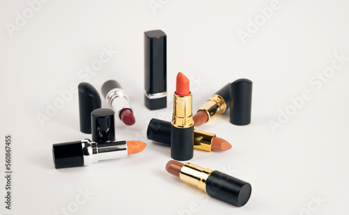 A set of various lipsticks on a white background. © Roman