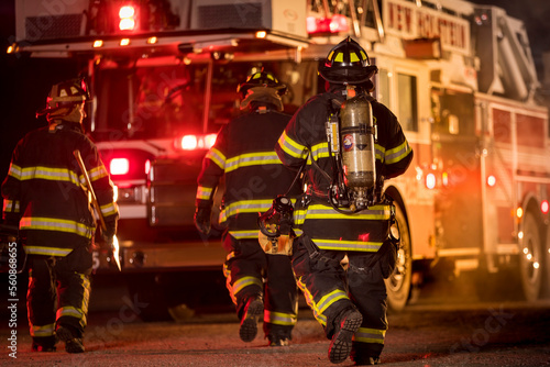 Three firefighters with different fire equipment, New Holstein, Wisconsin, USA
