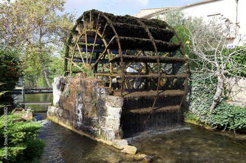 The Tourelles water wheel on the Sorgue River in L'Isle-sur-la-Sorgue, Provence, France. photo