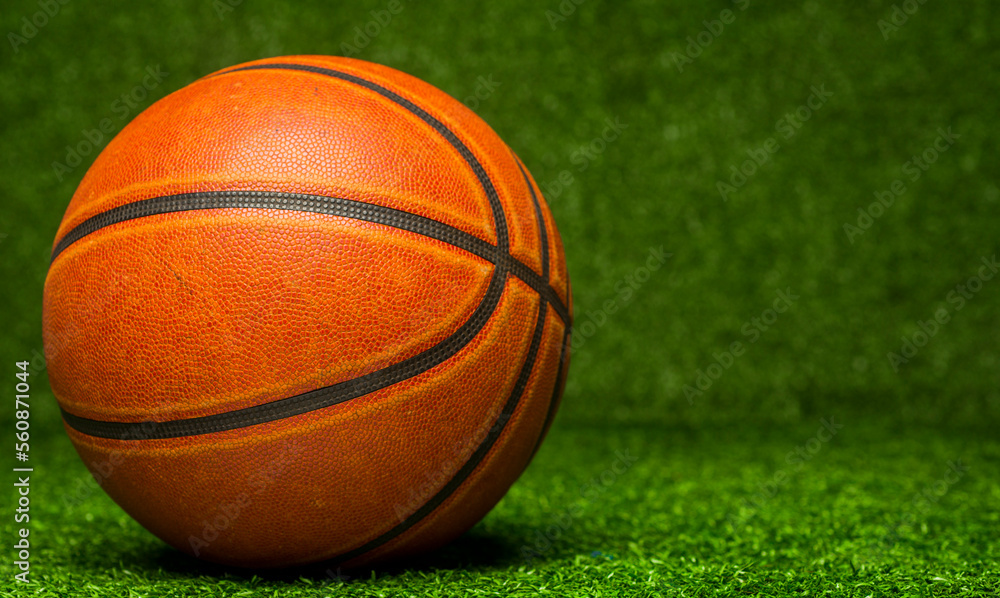 basketball ball on green background basketball ball on green background