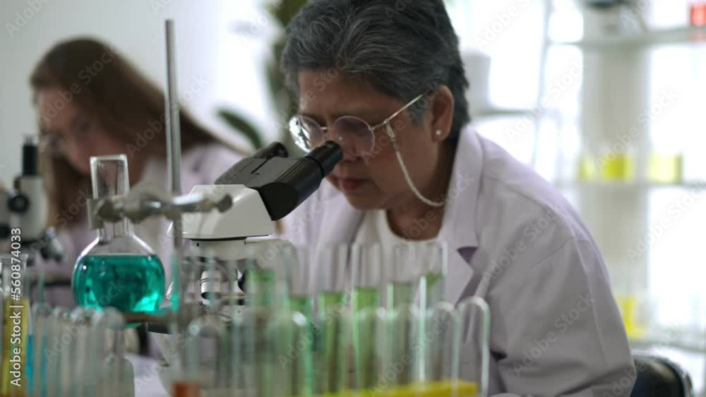 Senior woman scientist working in Modern Medical Research Laboratory Senior woman scientist working in Modern Medical Research Laboratory