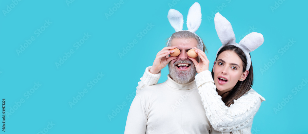 Easter couple. Smiling happy spring couple looking camera. Wide photo banner for website header design. Easter couple. Smiling happy spring couple looking camera. Wide photo banner for website header design.