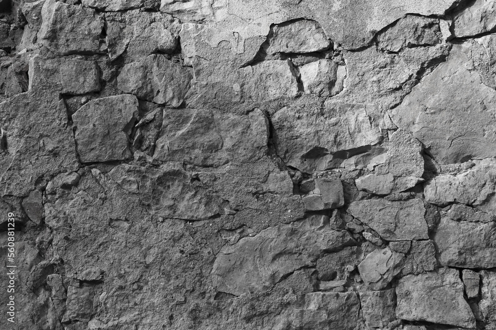 gray background, in the photo an old gray stone wall close-up gray background, in the photo an old gray stone wall close-up