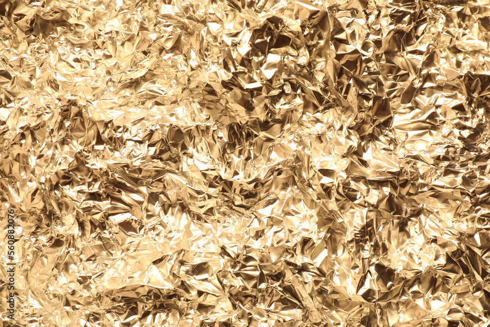 Crumpled gold foil as background, top view Crumpled gold foil as background, top view