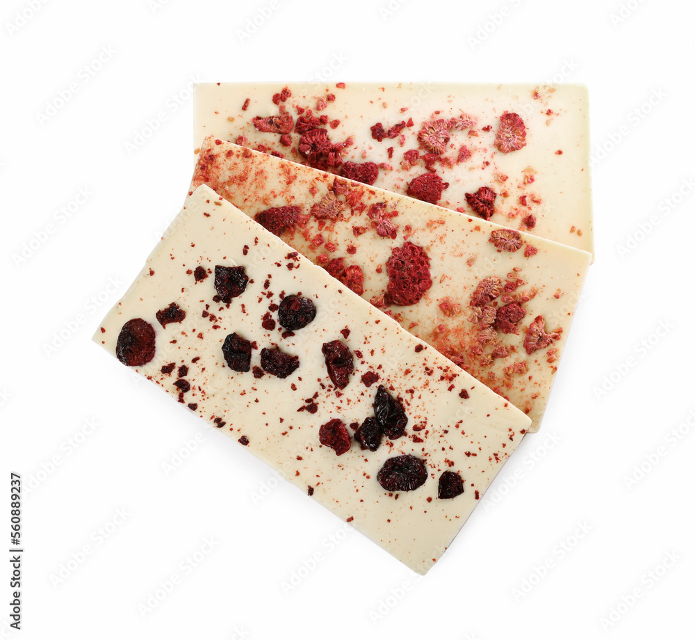 Chocolate bars with freeze dried berries on white background, top view Chocolate bars with freeze dried berries on white background, top view