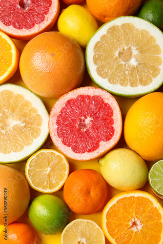 Fototapeta Naklejka Na Ścianę i Meble -  Different ripe citrus fruits as background, top view