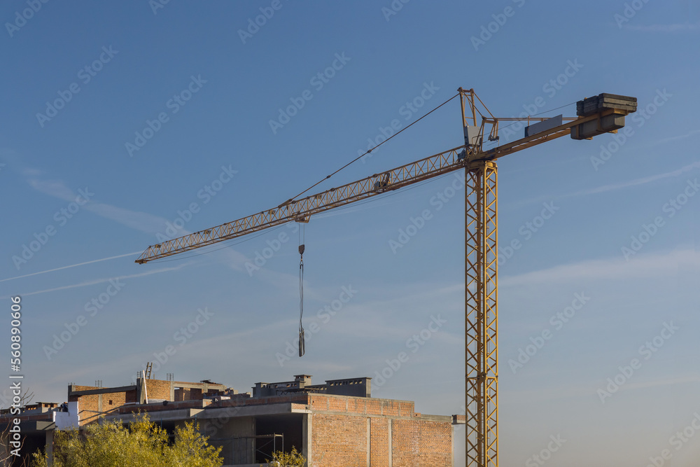 Multi storey apartment building is being constructed using tower cranes that can reach heights as work progresses