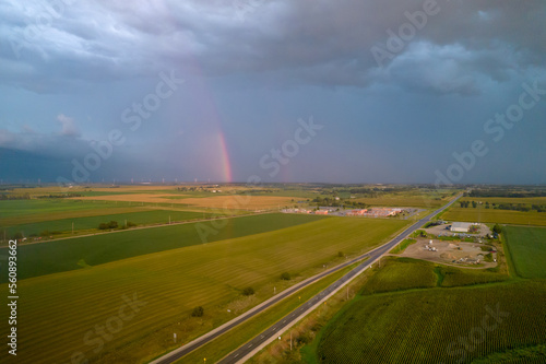 Aerial view of landscape after rain  rainbow in clouds