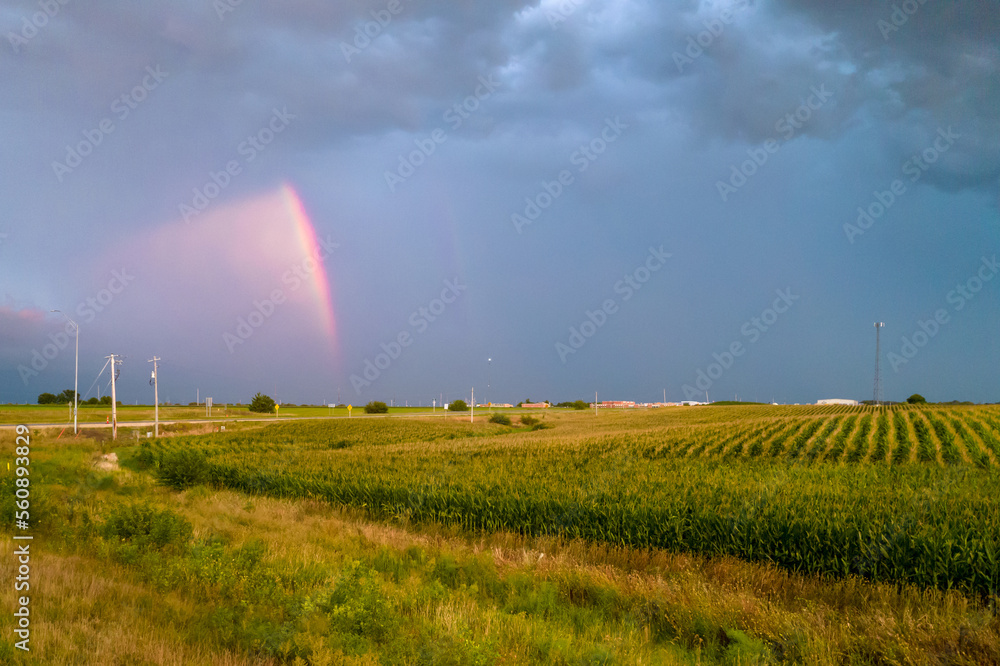 Aerial view of landscape after rain, rainbow in clouds Aerial view of landscape after rain, rainbow in clouds