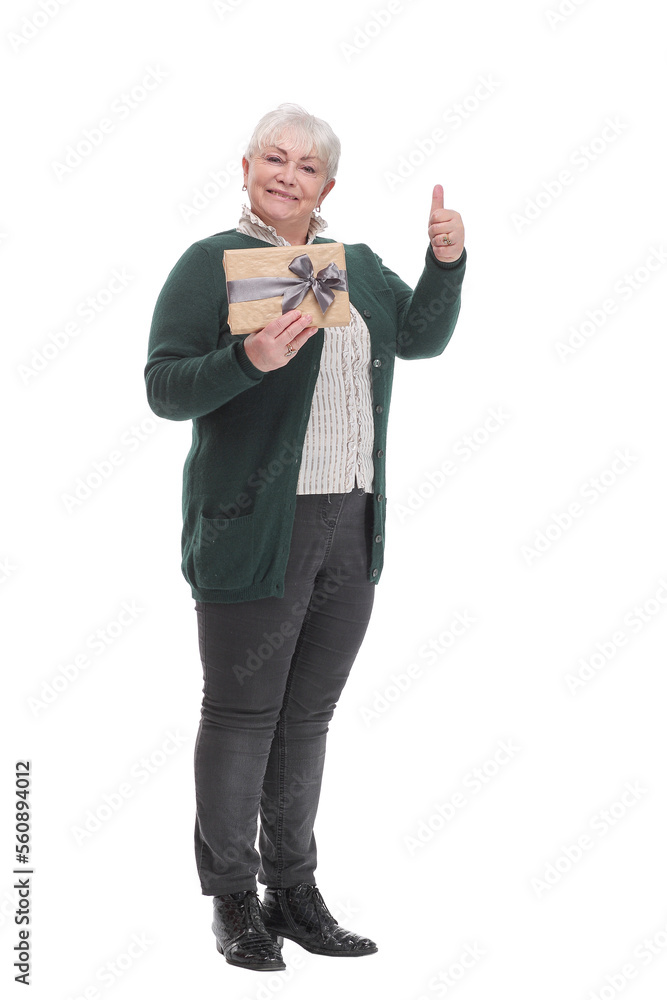 Full body senior woman happy and smiling, holding a gift box with ribbon