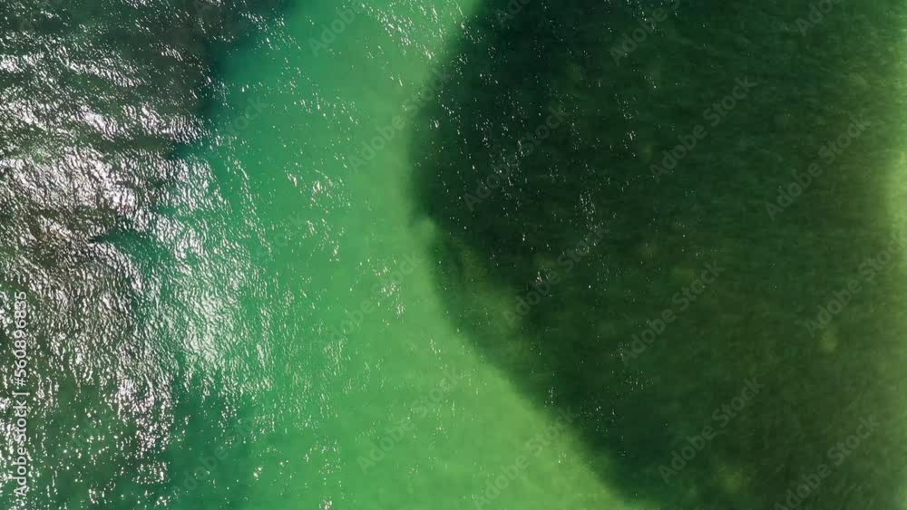 Aerial Top Forward Shot Of Shiny Sea During Sunny Day - Oahu, Hawaii Aerial Top Forward Shot Of Shiny Sea During Sunny Day - Oahu, Hawaii