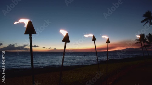 Tiki Torches With Fire In The Evening At Tropical Beach In Wailea, Maui, Hawaii. wide photo