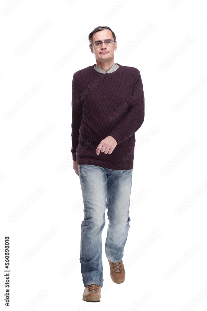 casual man in jeans and jumper striding forward casual man in jeans and jumper striding forward