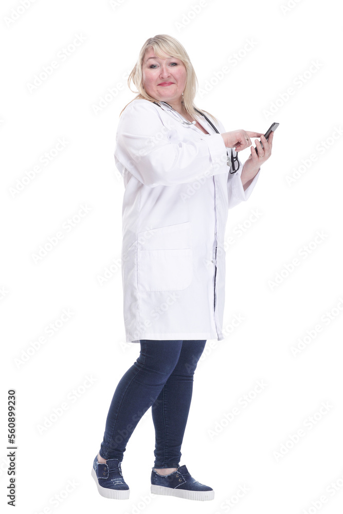 Mature woman doctor choosing contact in her smartphone . Mature woman doctor choosing contact in her smartphone .