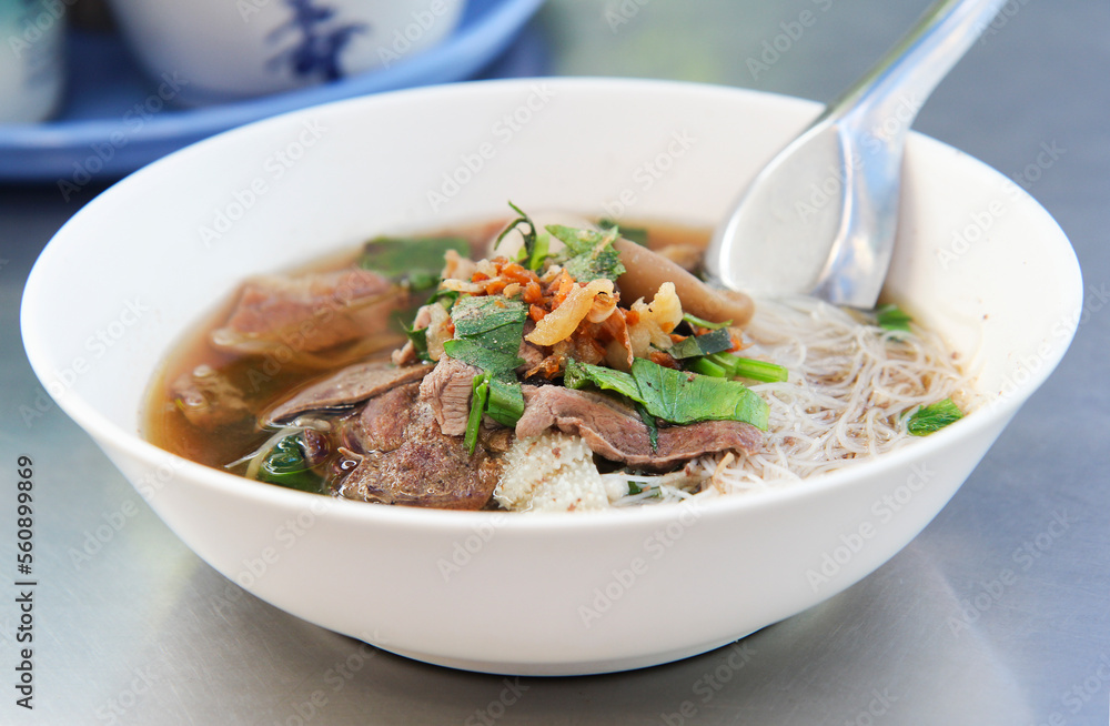 Braised Beef Vermicelli Noodles, on stainless steel table close up
Braised Beef Vermicelli Noodles, on stainless steel table close up