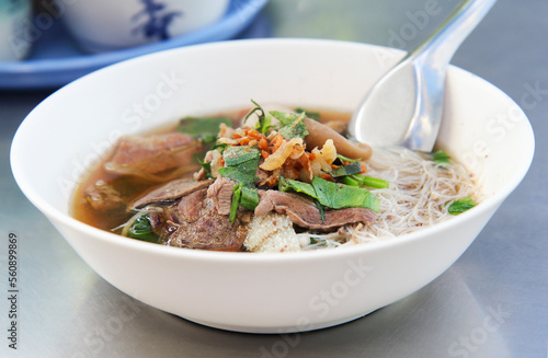 Braised Beef Vermicelli Noodles, on stainless steel table close up 
