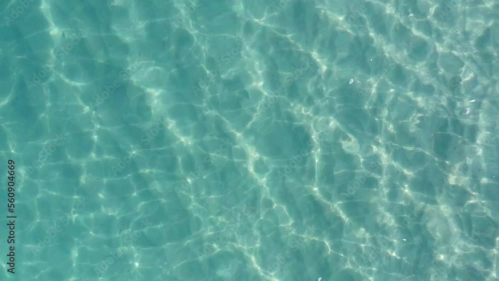 Aerial Top Lockdown Shot Of Rippled Blue Sea With Reflection Of Sunlight During Sunny Day - Oahu, Hawaii Aerial Top Lockdown Shot Of Rippled Blue Sea With Reflection Of Sunlight During Sunny Day - Oahu, Hawaii