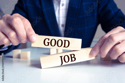 Closeup on businessman holding a wooden block with 