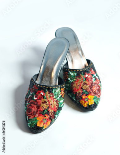 Black nyonya manek shoes or nyonya neaded shoes. A nyonya traditional shoes. Selective focus.