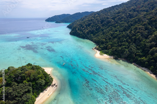 Sunny aerial view and aerial photographs of the beautiful tropical paradise beach of the Andaman Sea. amazing view Beach  turquoise water and coral amazing under the sea.