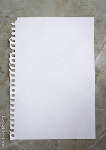 blank sheet of paper on a wooden background