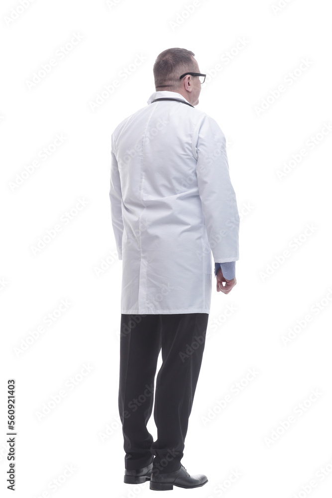 rear view. mature doctor reading an ad on a white screen rear view. mature doctor reading an ad on a white screen