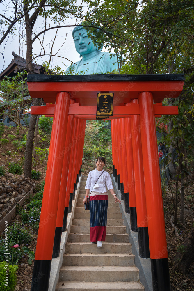 Asian girl tourist Wat Phra That Doi Phra Chan is the most famous Buddhist temple in Japanese style and the attraction landmark travel destination Lampang, Northern Thailand. Asian girl tourist Wat Phra That Doi Phra Chan is the most famous Buddhist temple in Japanese style and the attraction landmark travel destination Lampang, Northern Thailand.