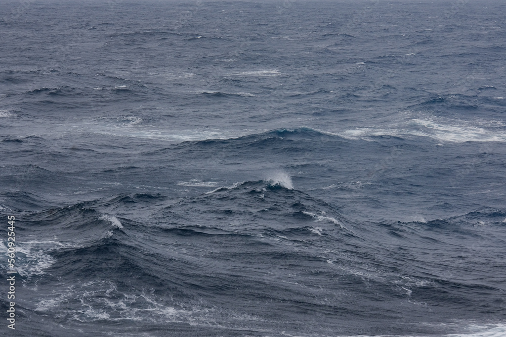 Stormy sea conditions with high swell waves on Atlantic Ocean during transatlantic passage crossing on ocean liner Stormy sea conditions with high swell waves on Atlantic Ocean during transatlantic passage crossing on ocean liner