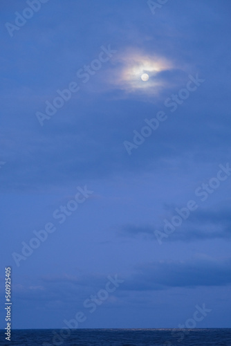 Full moon reflection on Atlantic Ocean during night seen from luxury ocean liner cruiseship cruise ship during transatlantic passage voyage