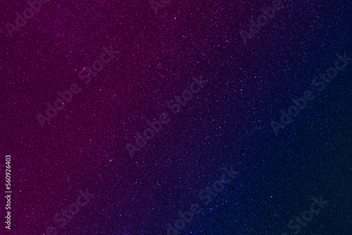 Sprayed black, Abstract background with diagonal gradient from blue to pink sprayed with black paint.