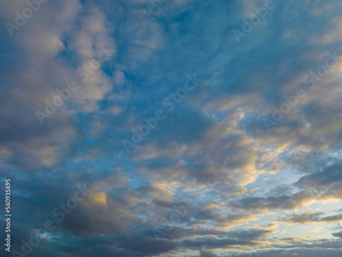 Sunrise and blue cloud covered sky