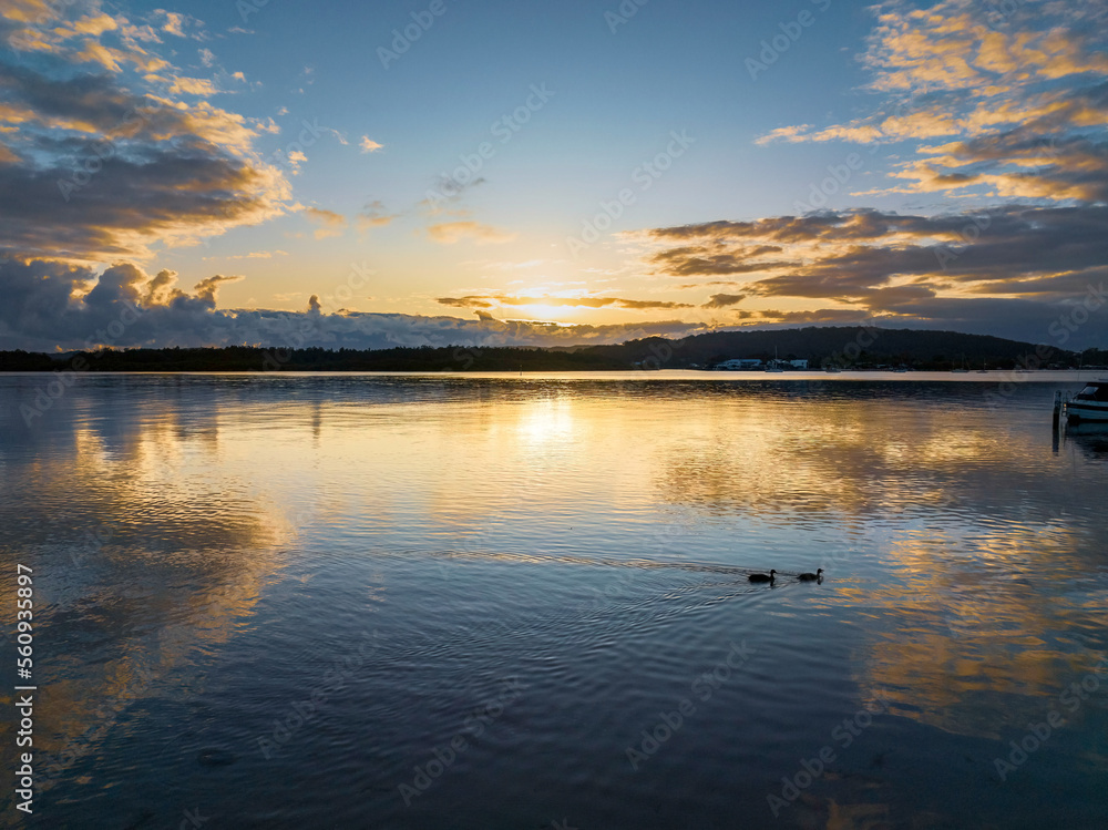 Sunrise over the bay with clouds and reflections Sunrise over the bay with clouds and reflections