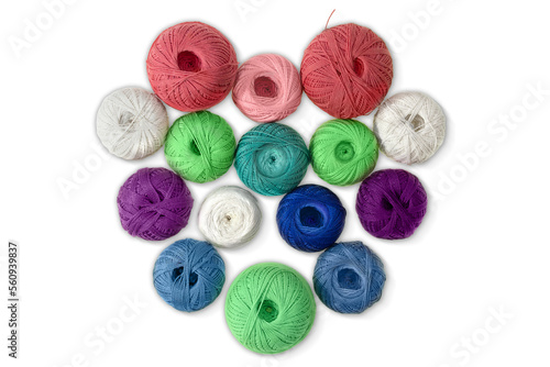 Multi-colored wool balls, yarn in shape of heart on white isolated background. Concept of knitting, sewing, needlework, hobby, Valentine day