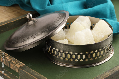 Indian sweet Petha or Agra Petha,  is a popular Indian sweet made from Ash Gourd. It is soft chewy and candy-like, eaten dry or dipped in sugar syrup or Chashni. It is sweet of Agra. photo