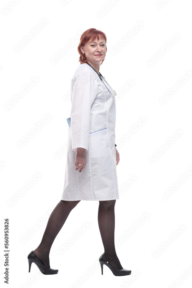 successful female doctor with a stethoscope striding forward.