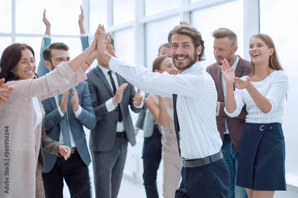 © ASDF - happy young businessman on business team background.