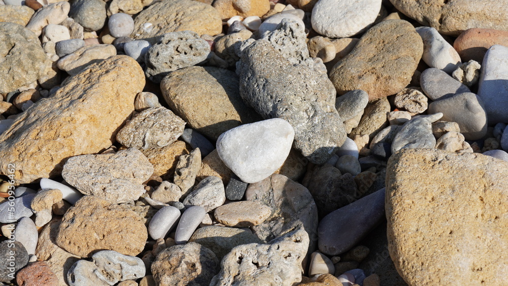 Cobble pieces of marble rock near water edge in Caesarea Maritima National Park, Israel. Cobble pieces of marble rock near water edge in Caesarea Maritima National Park, Israel.