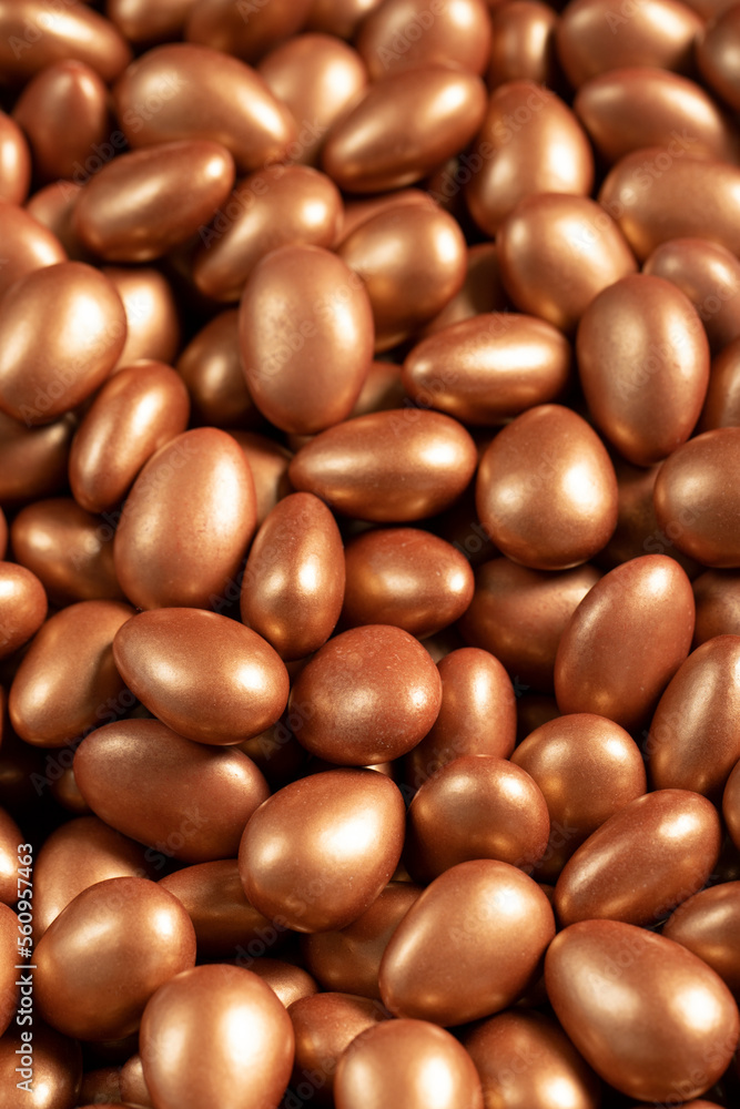 Chocolate dragee in the form of a pile. Brown dragee chocolate with chocolate filling. Close up Chocolate dragee in the form of a pile. Brown dragee chocolate with chocolate filling. Close up