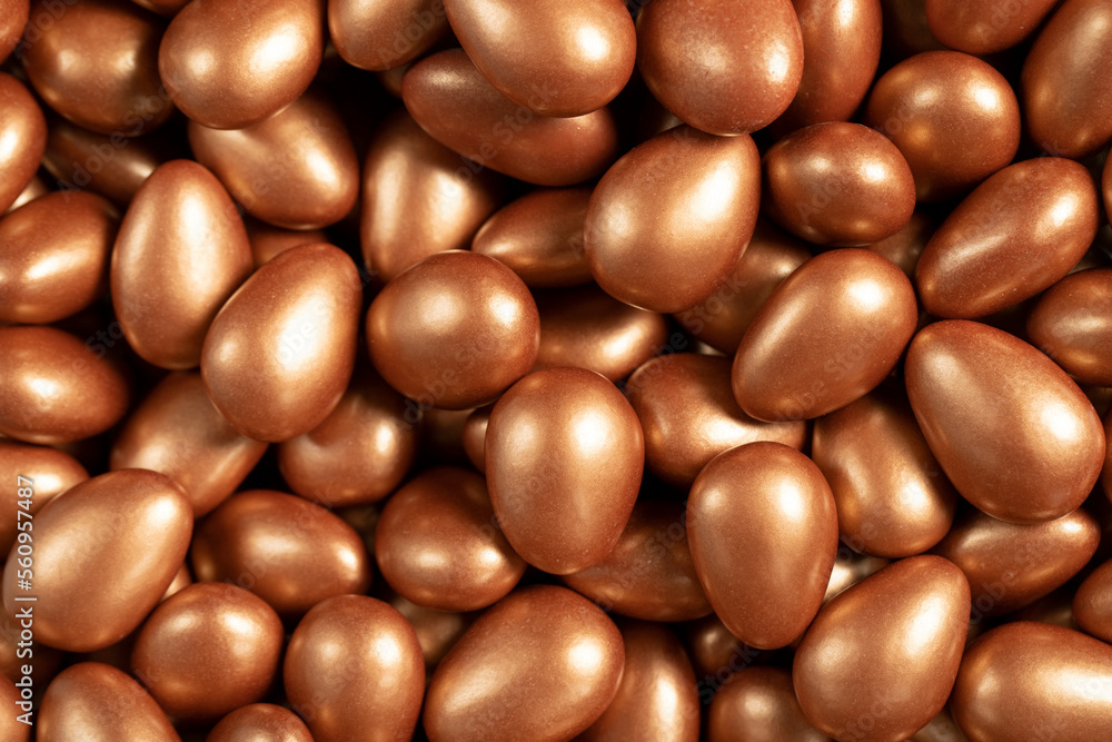 Chocolate dragee in the form of a pile. Brown dragee chocolate with chocolate filling. Top view. close up Chocolate dragee in the form of a pile. Brown dragee chocolate with chocolate filling. Top view. close up