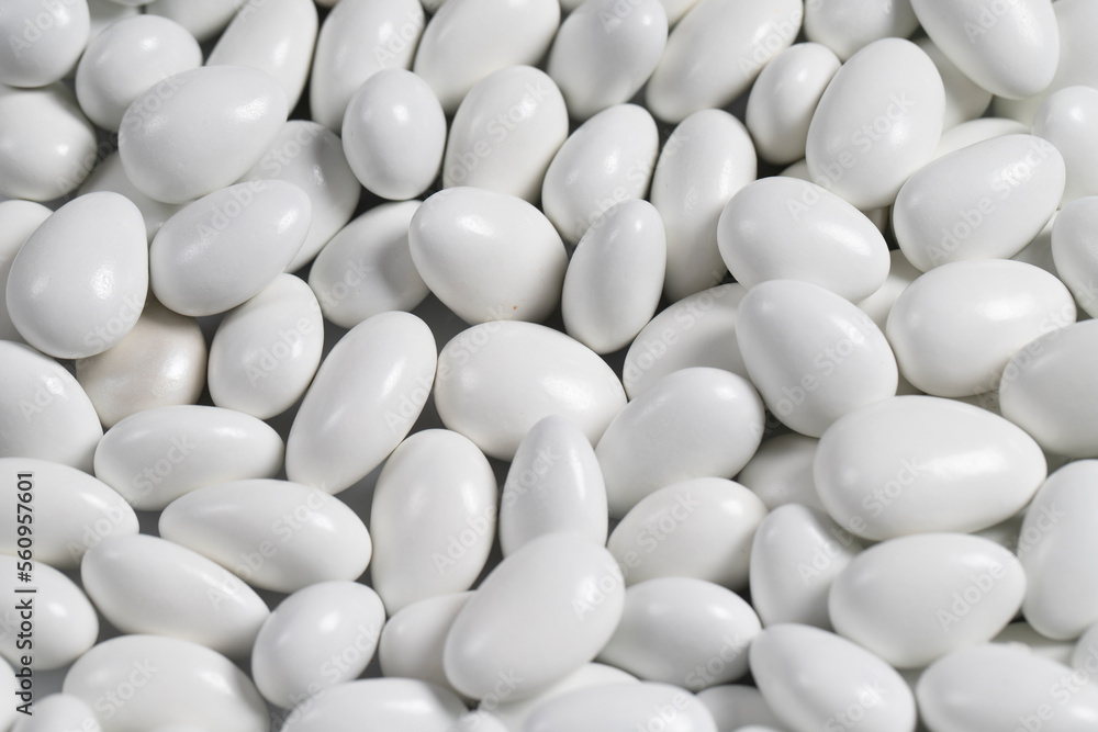 Almond candy in the form of a heap. Sugar coated on the outside, almond on the inside. close up Almond candy in the form of a heap. Sugar coated on the outside, almond on the inside. close up