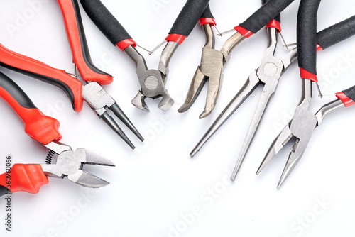 Set of different types of pliers and side cutters isolated on white background. Hand tools for repair, construction and maintenance